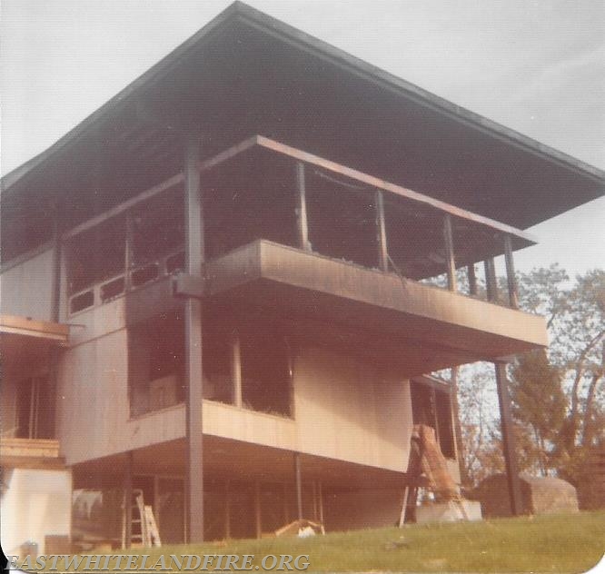 Major house fire in Charlestown Township 1974. Drafting from a large pond for additional water source.